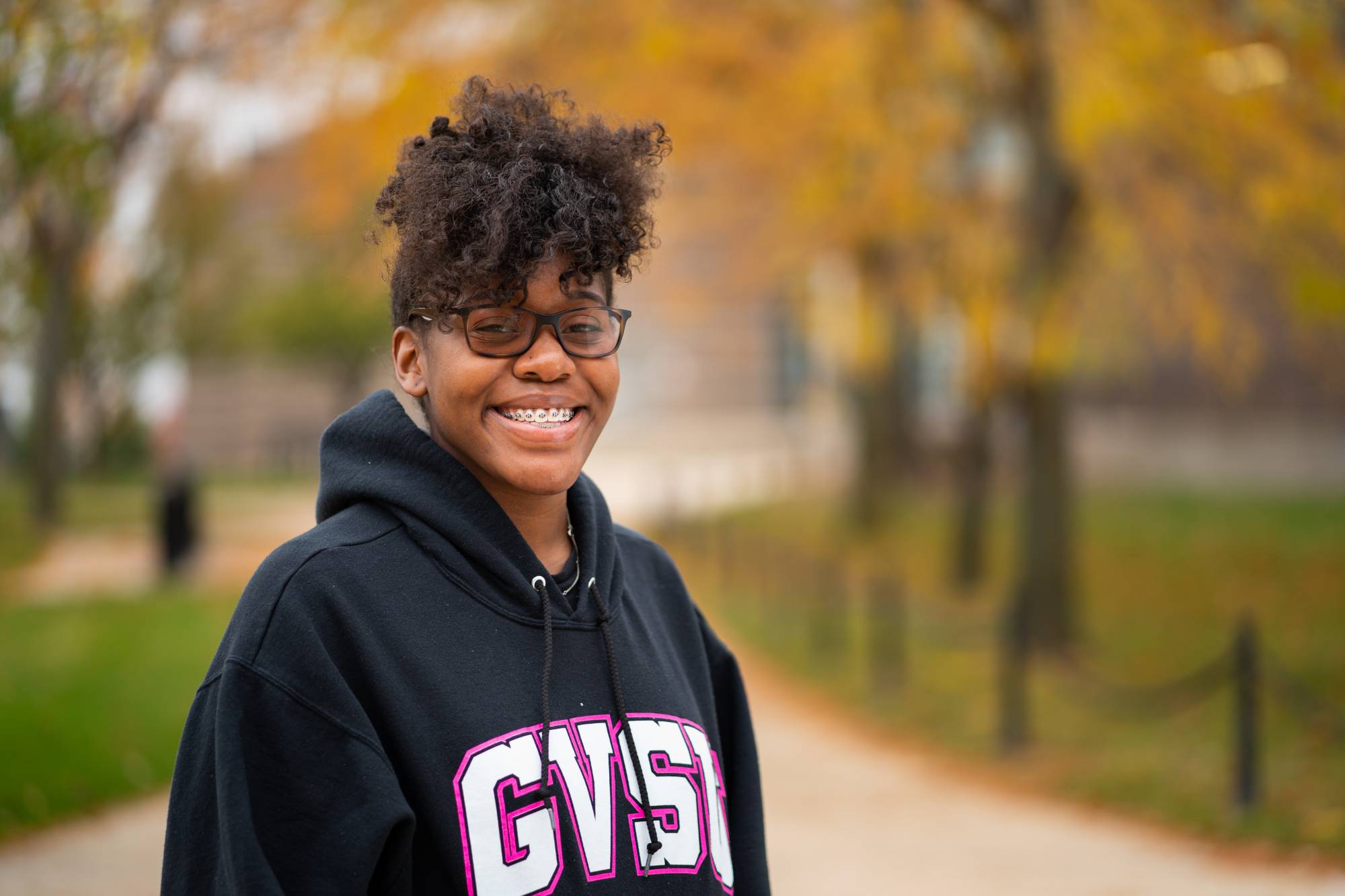Student smiling on GVSU campus
